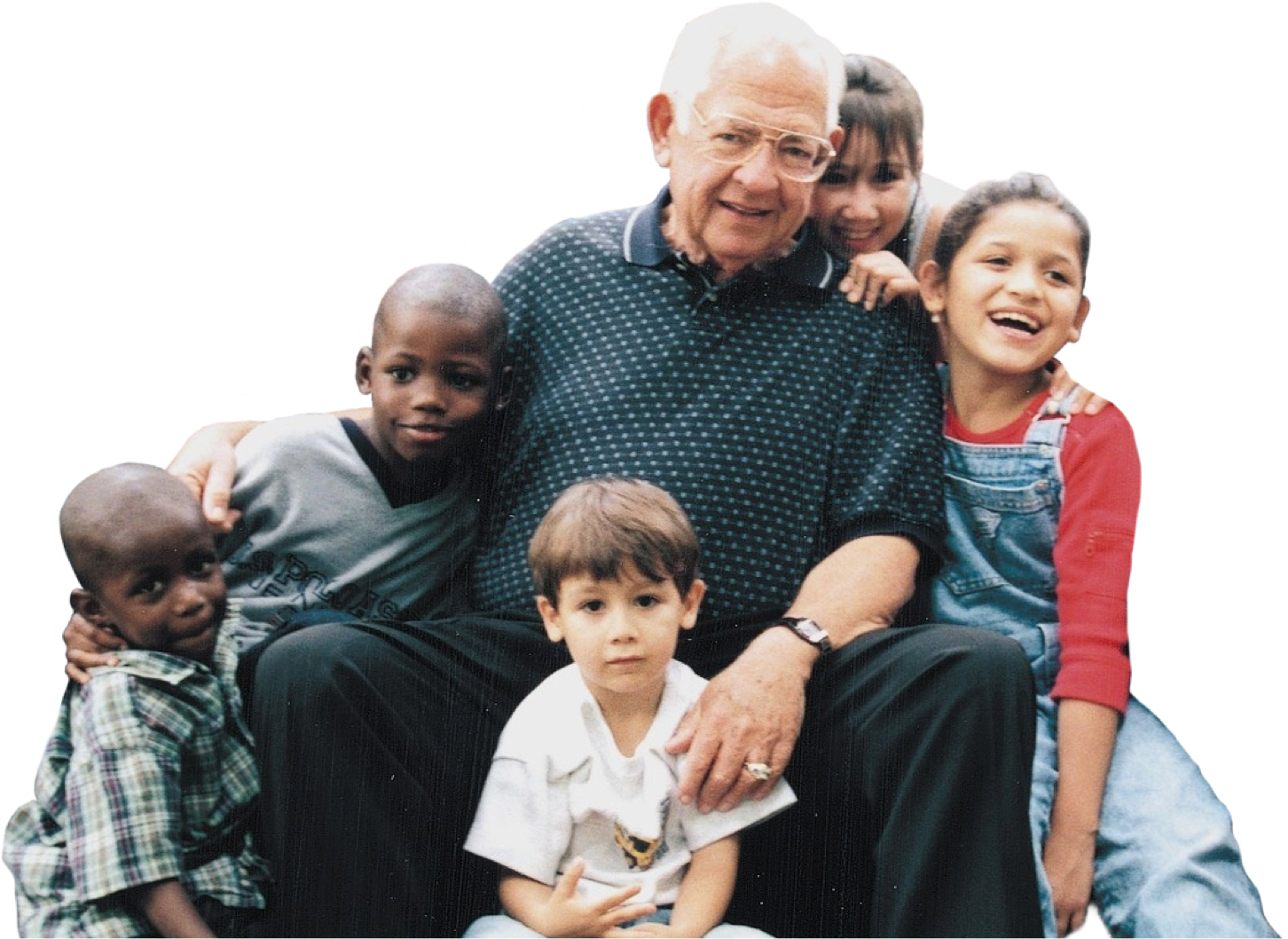 Dave Thomas and a group of children smiling and laughing.