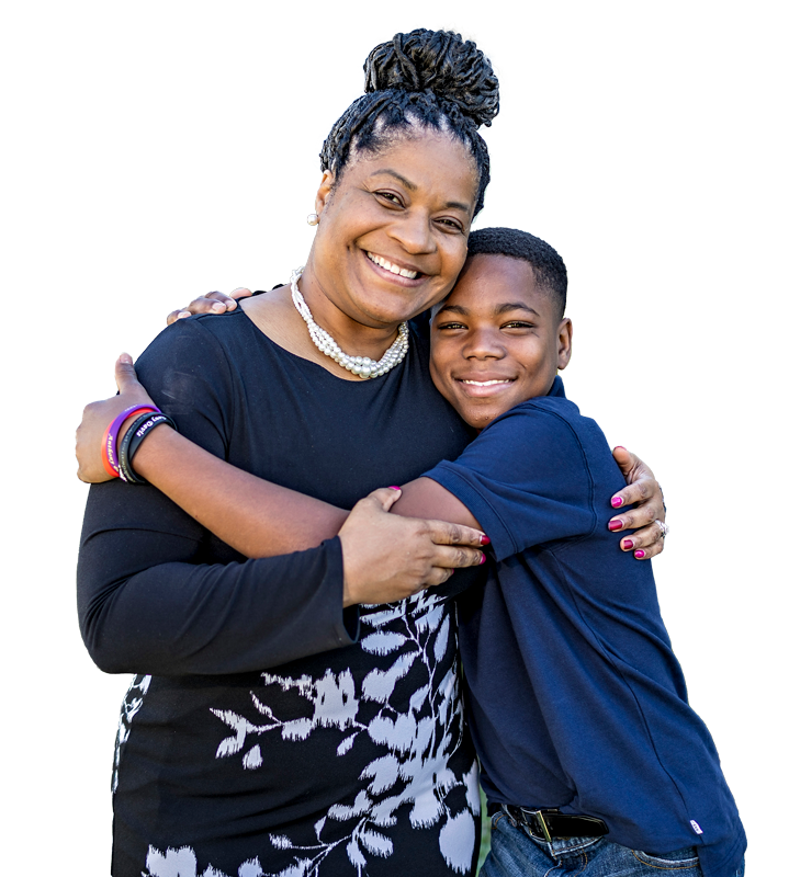 Will, a youth served by Wendy's Wonderful Kids, and his mom, Stefanie, embracing