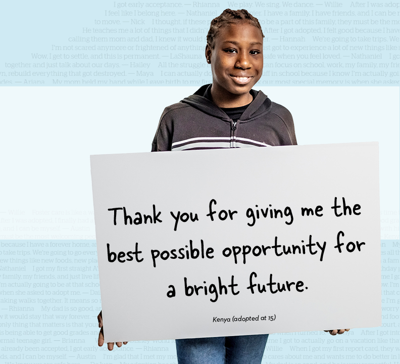 Youth holding a poster board thanking donors