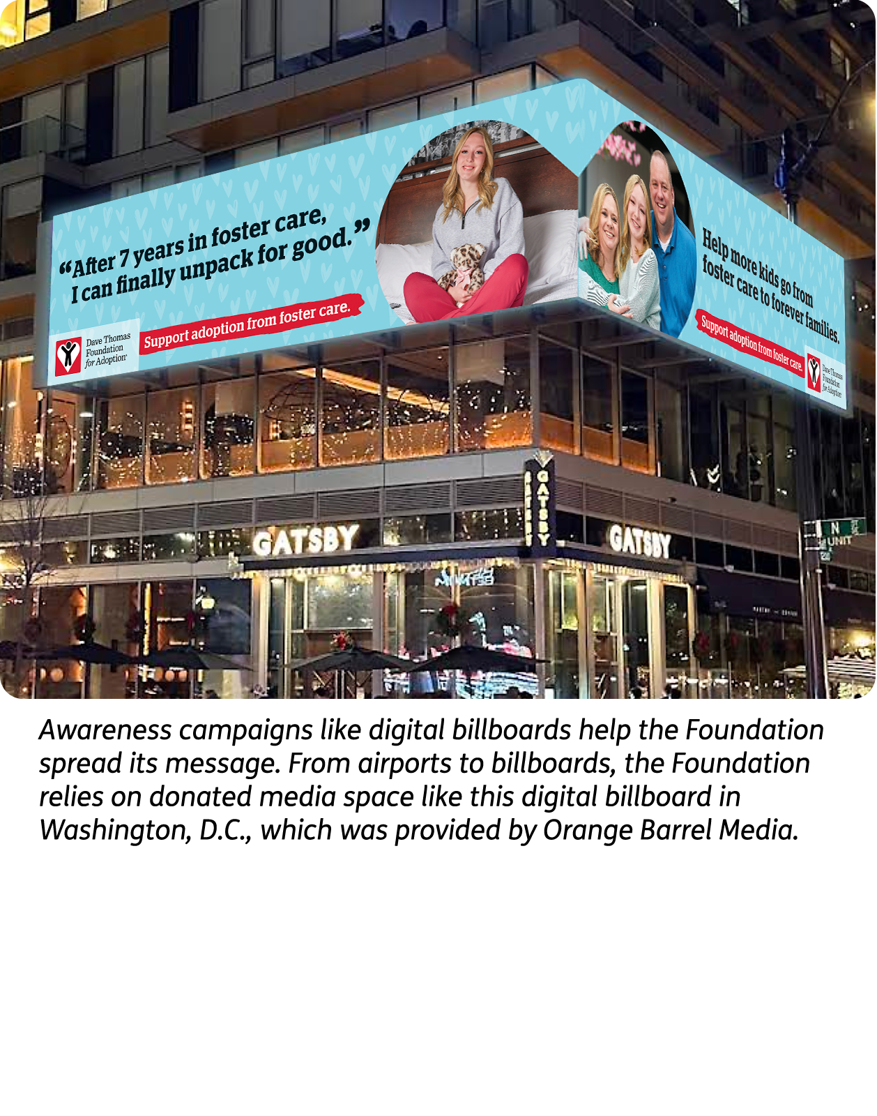 A large screen covering two sides of a downtown building displaying an ad to support adoption from foster care.